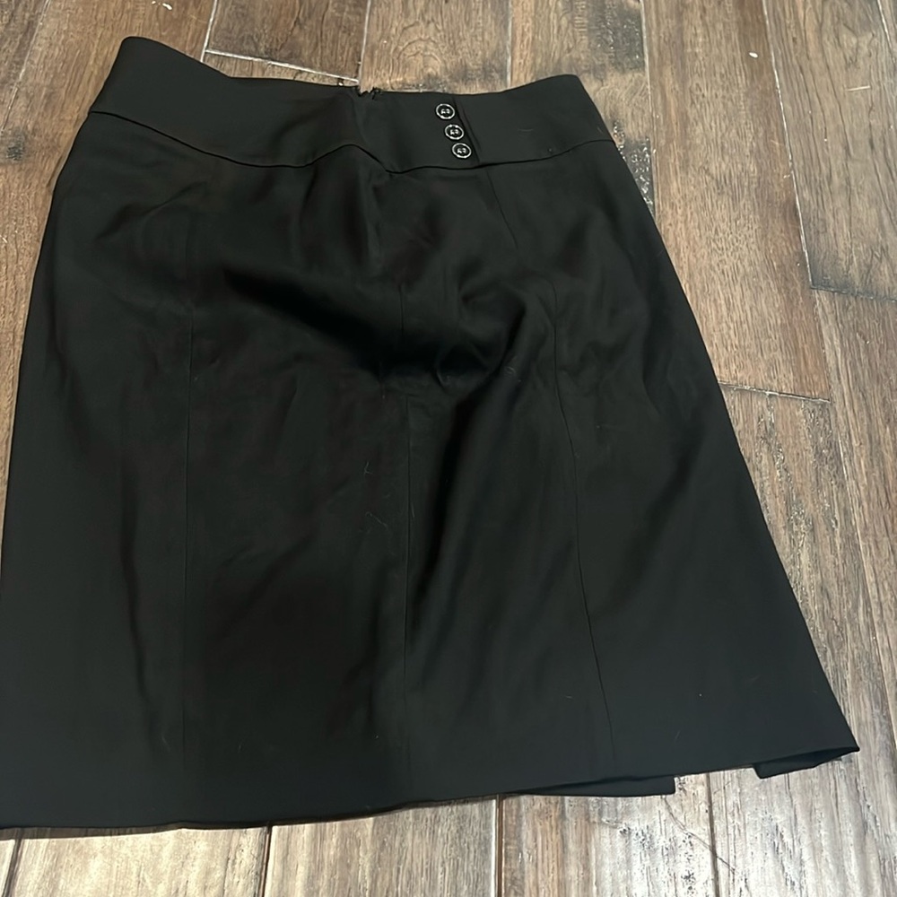 White House black market skirt ends before the knee